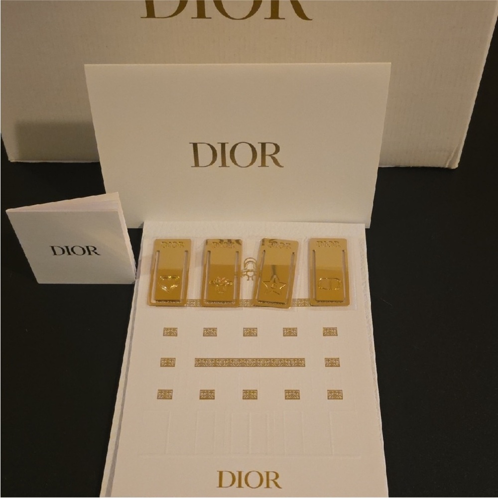 Dior Set of 4 Faux Gold Embossed Bookmarks enclosed in white cardboard folder